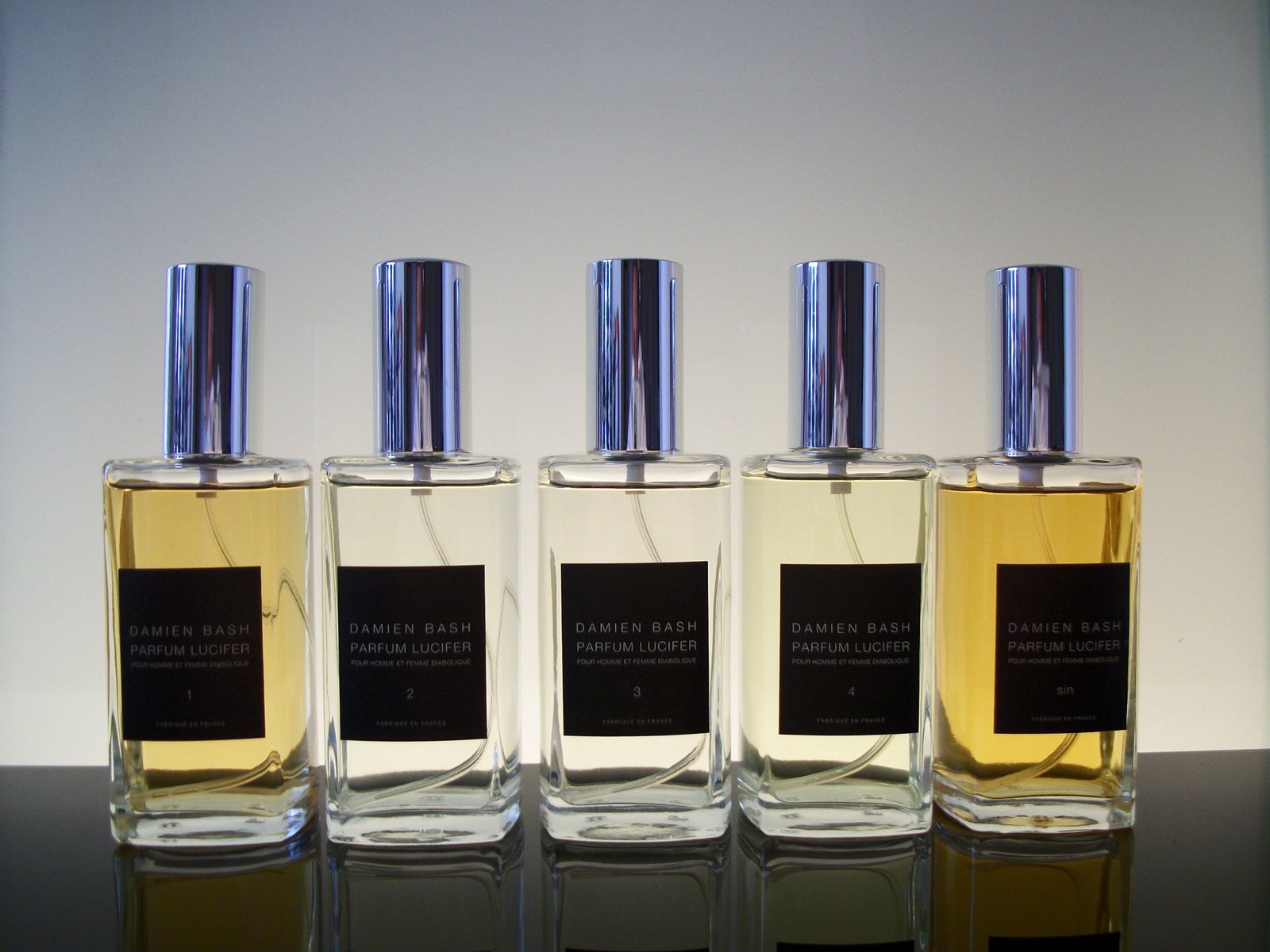 Damien Bash Parfum Lucifer bottle line, numbered 1 through 4 and Sin